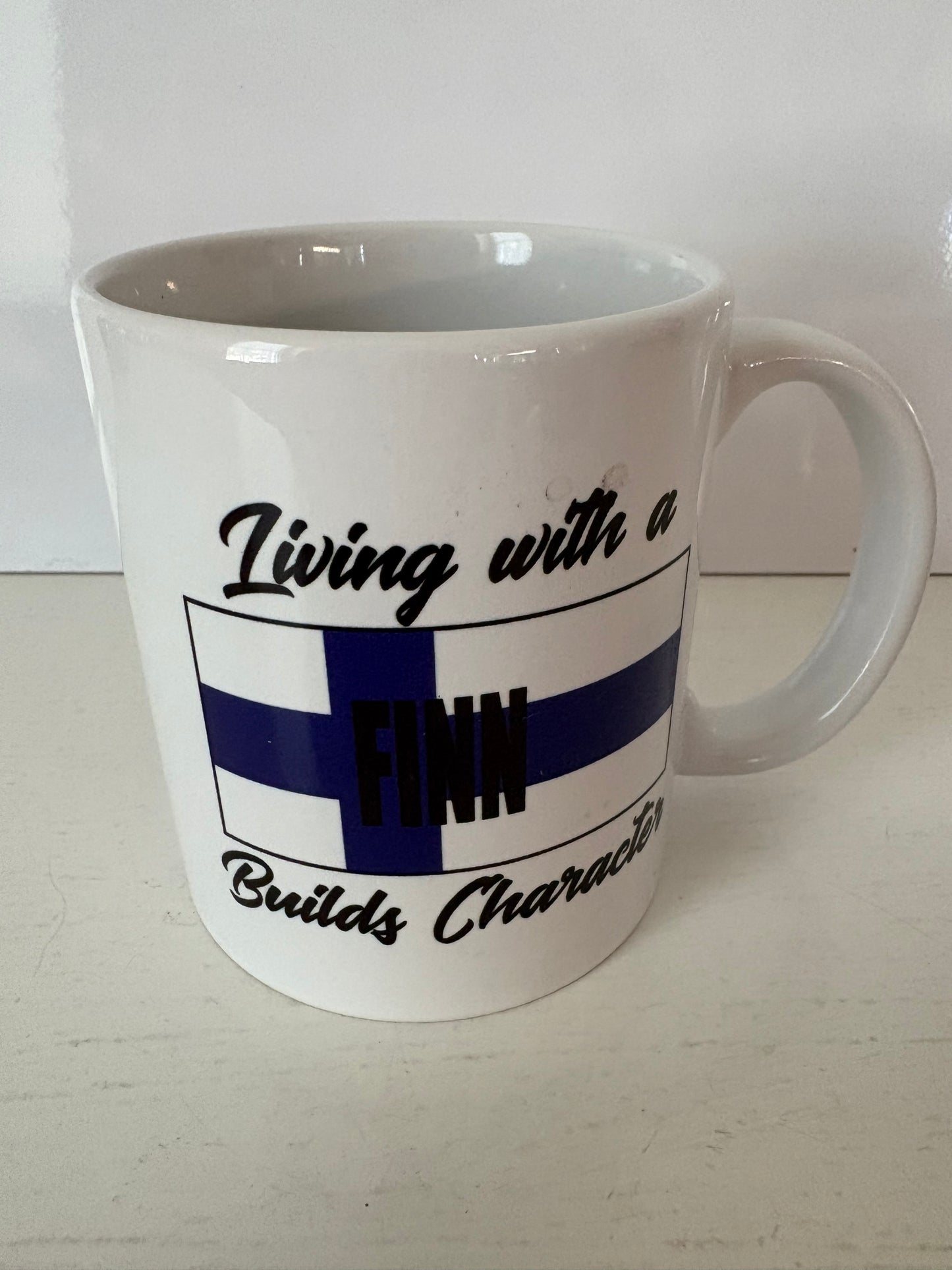 Living with a Finn Builds Character Mug