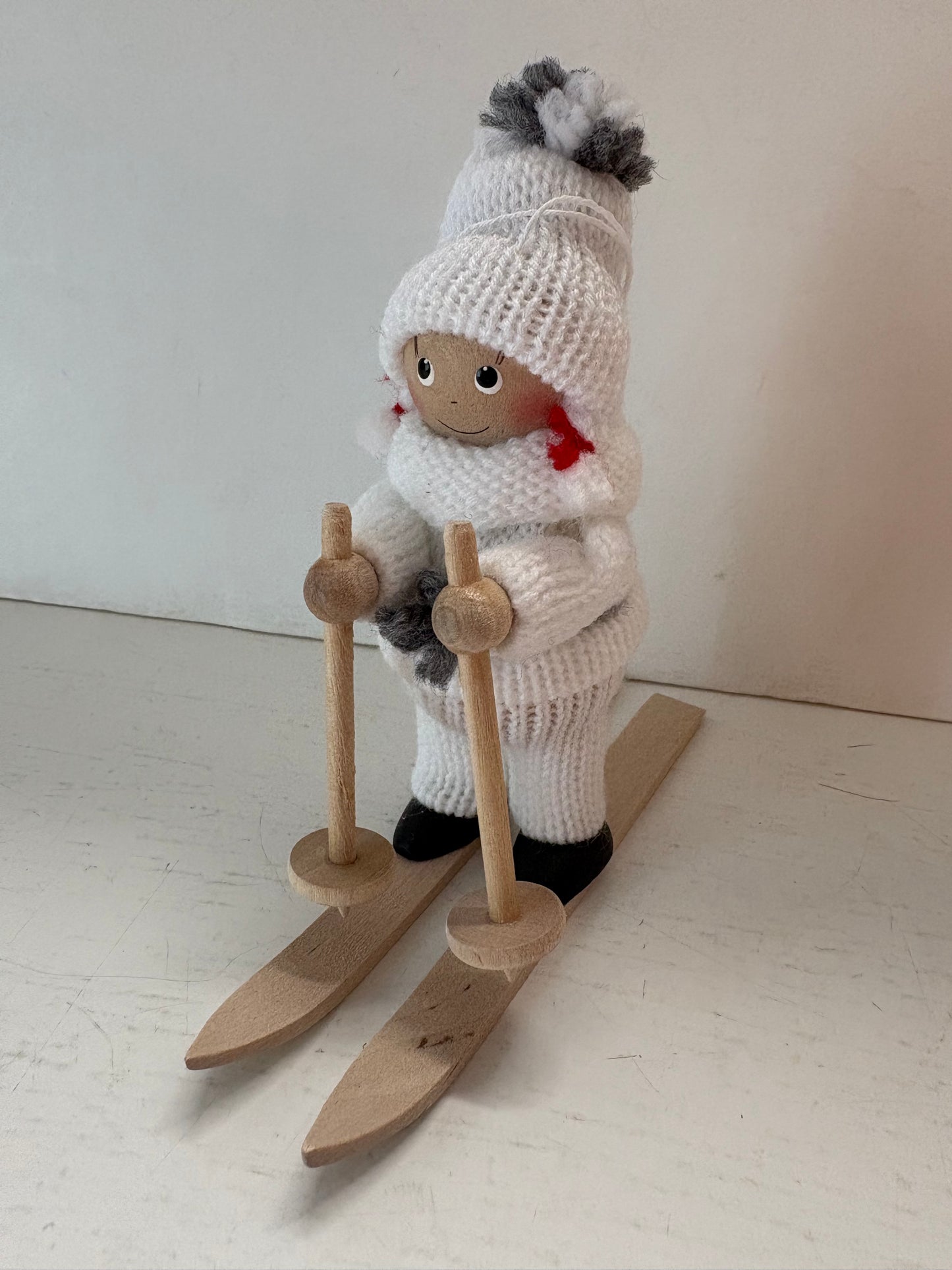 Skier in White Outfit